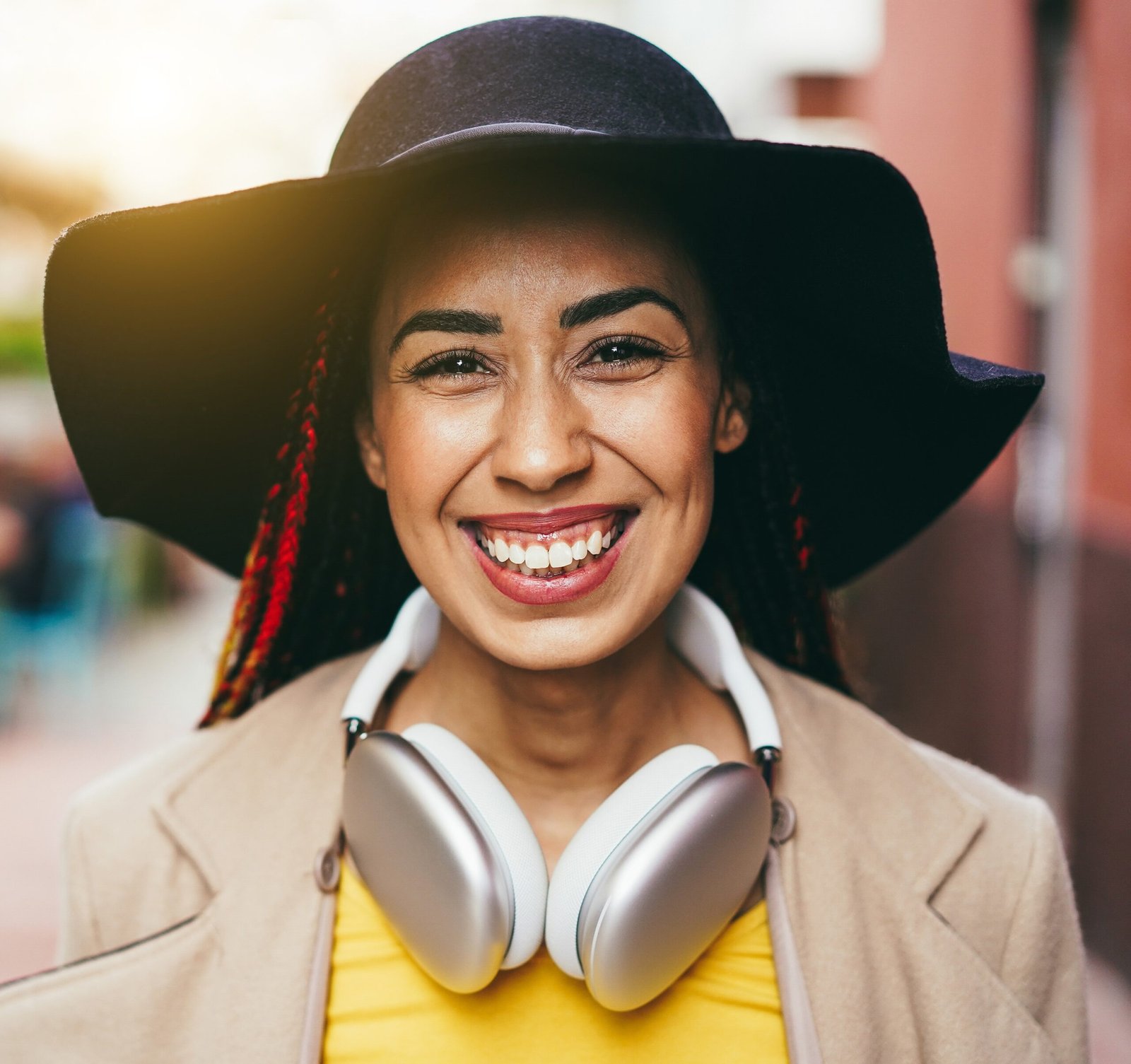 Mixed race girl listen playlist music with headphones outdoor - Focus on face